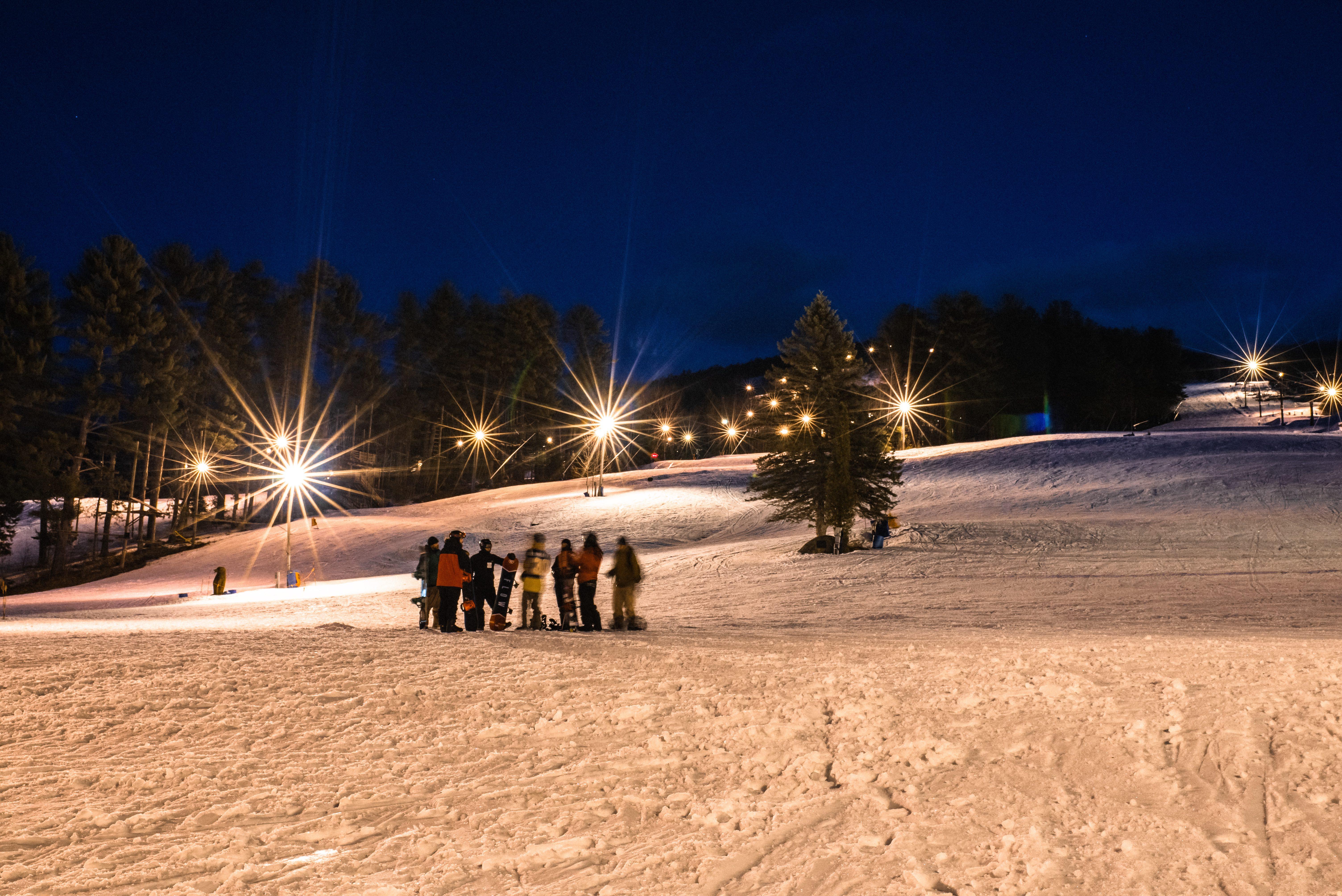 Group of people night skiing